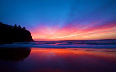 惊人的日落海滩Mac壁纸