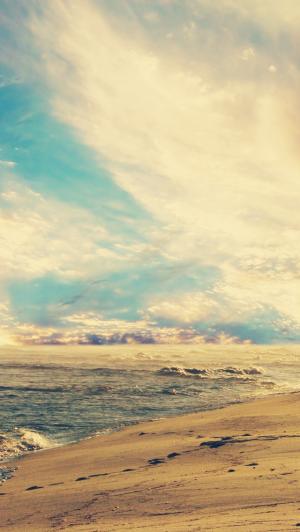 在日落iPhone 5壁纸的海滩波浪